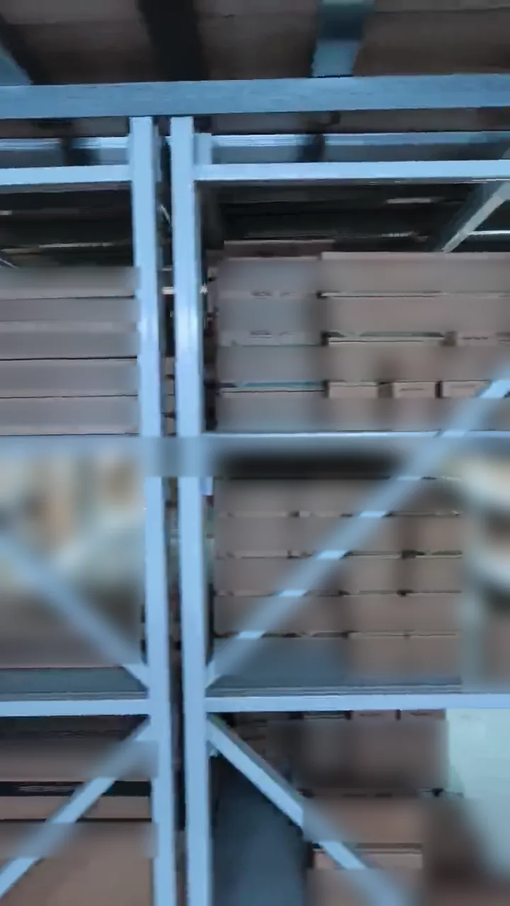 Boxed parts on metal warehouse shelves